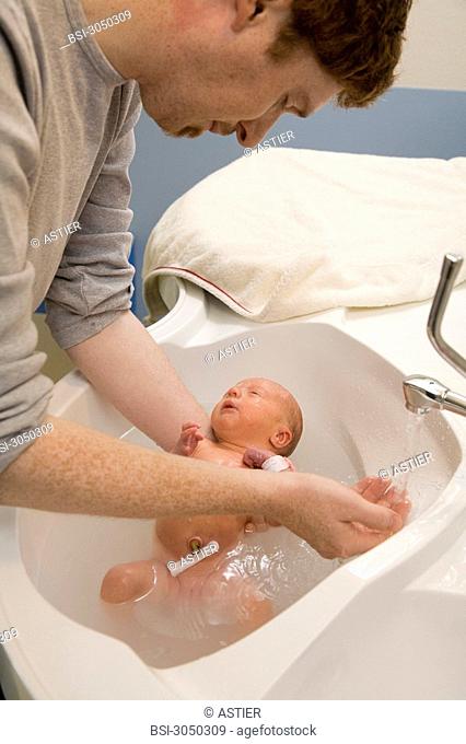Photo essay at the maternity of Saint-Vincent de Paul hospital, Lille, France. Washing of the newborn baby