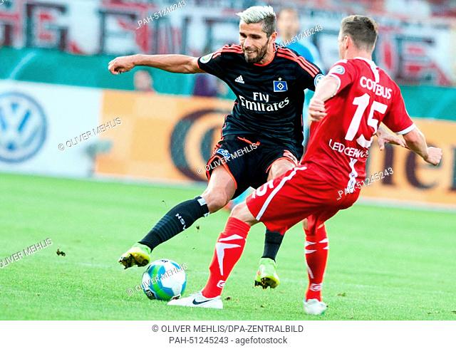 Hamburg's Valon Behrami and Cottbus' Nikolas Ledgerwood in action during the DFB Cup first round match between FC Energie Cottbus and Hamburg SV at the Stadion...