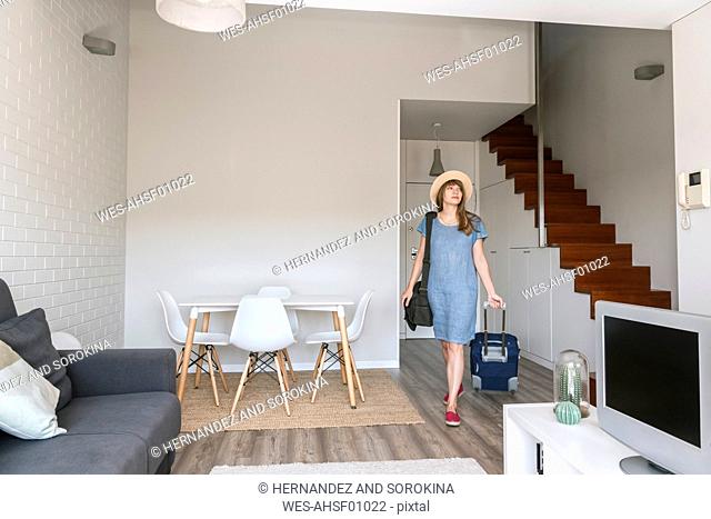 Tourist entering modern vacation home