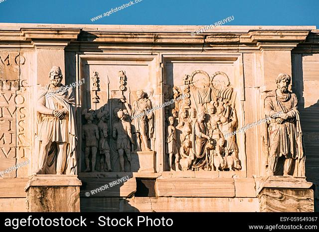Rome, Italy. Details Of Arch Of Constantine. Statue And Bas-relief On Facade Of Triumphal Arch