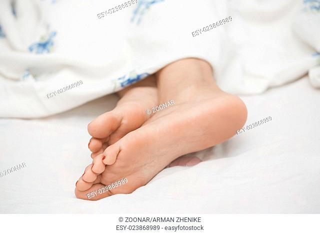 Feet of sleeping woman