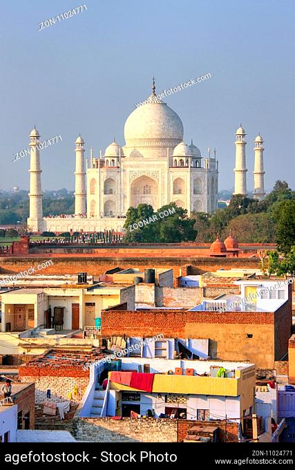 Rooftops of Taj Ganj neighborhood and Taj Mahal in Agra, India. Taj Mahal was build in 1632 by Emperor Shah Jahan as a memorial for his second wife Mumtaz Mahal