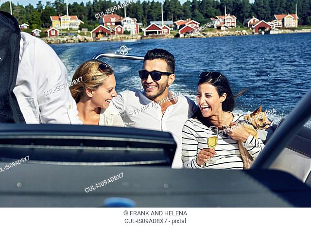 Young adults on boat, Gavle, Sweden