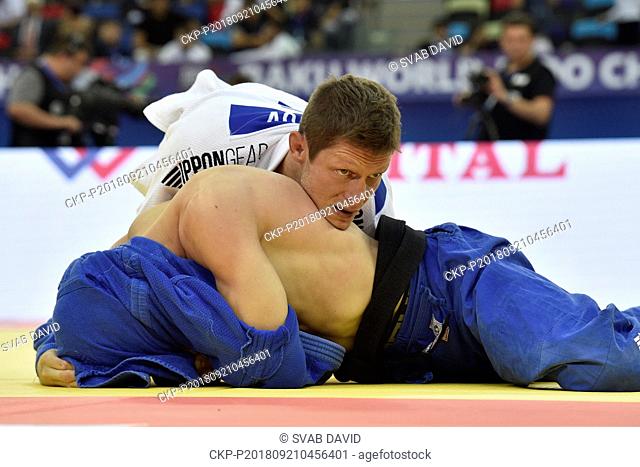 Czech judoka Pavel Petrikov (in white) competes during the match against Strahinja Buncic from Serbia during 3rd round of men's 66kg class in World Judo...