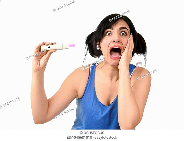 young pregnant woman scared in shock checking pink positive result on pregnancy test surprised and stressed in accidental motherhood and unwanted baby isolated...