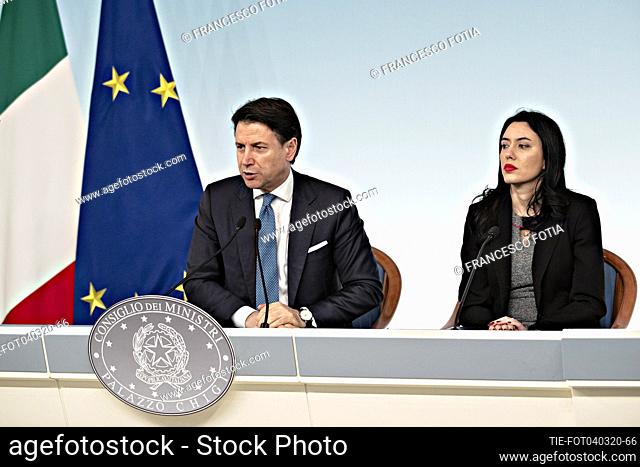 Italian Prime Minister Giuseppe Conte (L) with Italian Education Minister Lucia Azzolina (R) during a press conference about Italy's coronavirus emergency...