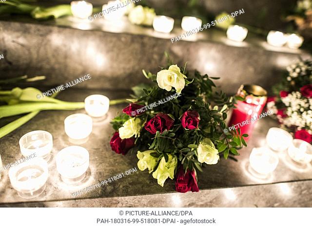 16 March 2018, Germany, Flensburg: Flowers and candles are placed in front of the altar during the memorial service for a 17-year-old in St
