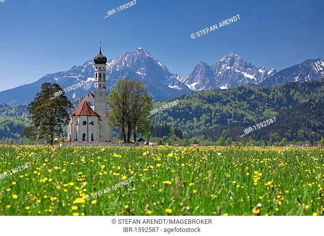 St. Coloman's Church near Tegelberg Mountain and Neuschwanstein Castle, Schwangau near Fuessen, Allgaeu region, Bavaria, Germany, Europe