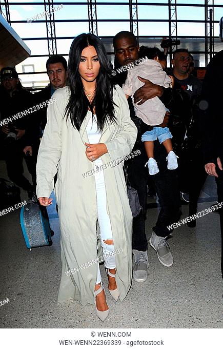 Kim Kardashian, Kanye West and North West depart from Los Angeles International Airport (LAX) Featuring: Kim Kardashian, Kanye West