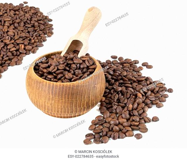 Coffee beans in bowl with wooden shovel