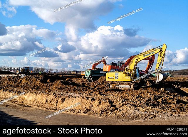 Construction site with excavator in summer
