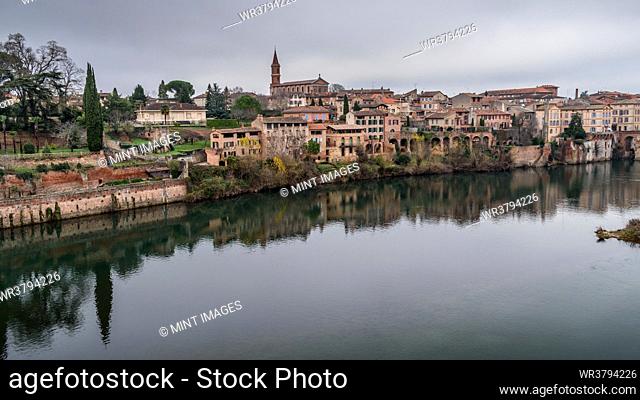 View of Albi, the city and historic buildings from the River Tarn, the Pont Vieux and an island in the stream