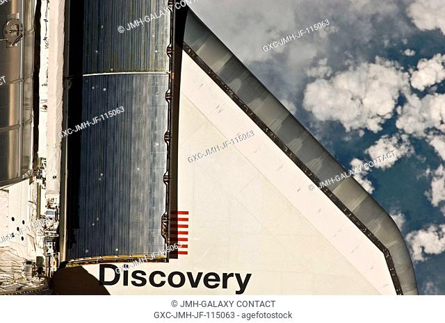 This partial view of the starboard wing of the space shuttle Discovery was provided by an Expedition 26 crew member during a survey of the approaching STS-133...
