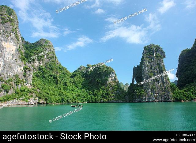 Boat and limestone karst in Ha long, Halong Bay, Vietnam, Ha long, Halong Bay, Vietnam