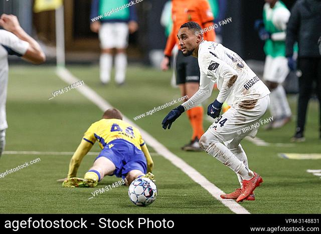 STVV's Christian Bruls and Union's Loic Lapoussin fight for the ball during a soccer match between Sint-Truidense VV and Royale Union Saint-Gilloise