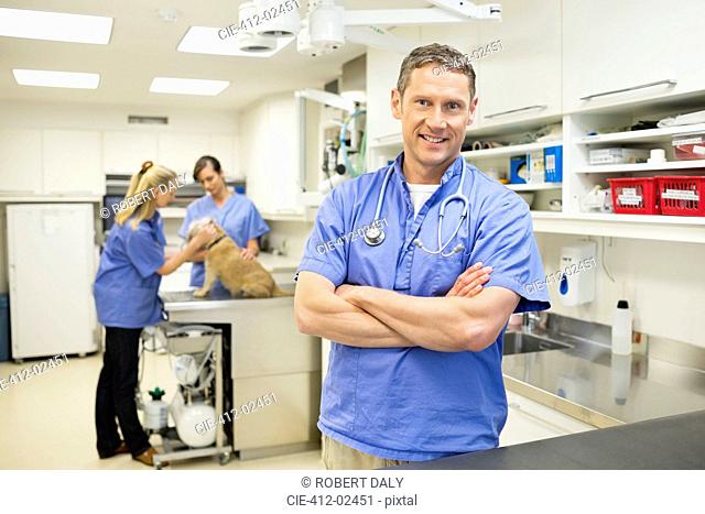Smiling veterinarian standing in vet’s surgery