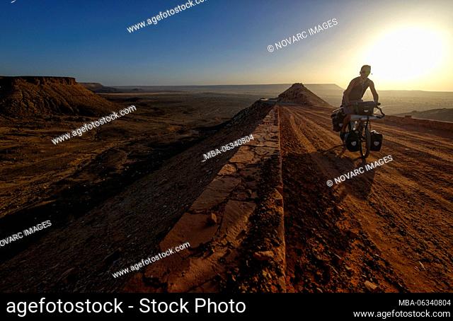 Cycling in the Adrar region of the Sahara desert, Mauritania