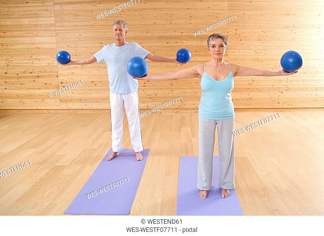 Mature couple with gymnastic ball