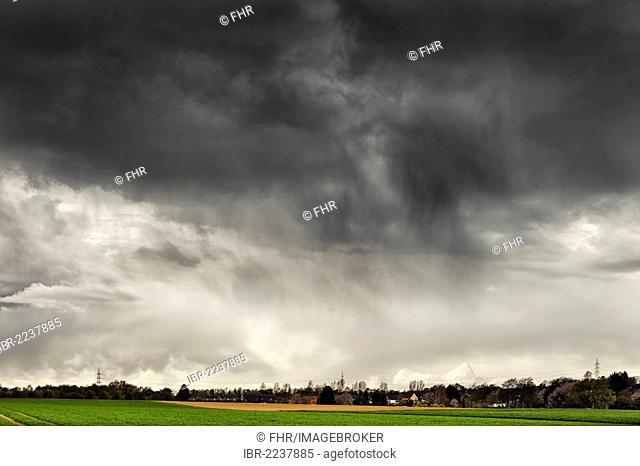 Dark rain clouds over the landscape in April, Grevenbroich, North Rhine-Westphalia, Germany, Europe