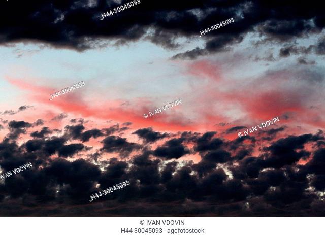 Clouds on sunset sky, background
