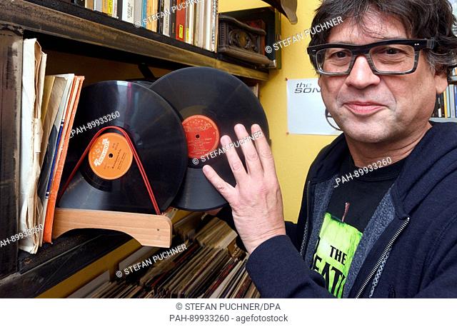dpatop - Martin Haag shows a shellac record in his record shop, ""Sound Circus"", in Ulm, Germany, 18 April 2017. The 10th International Day of Independent...