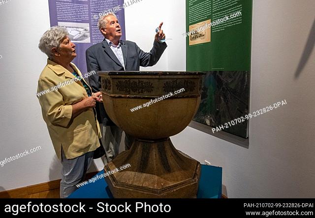 02 July 2021, Saxony, Torgau: Klaus-Peter Röber stands with his wife Ursula in the exhibition ""Lost Places. Lignite Mining and Structural Change in the...