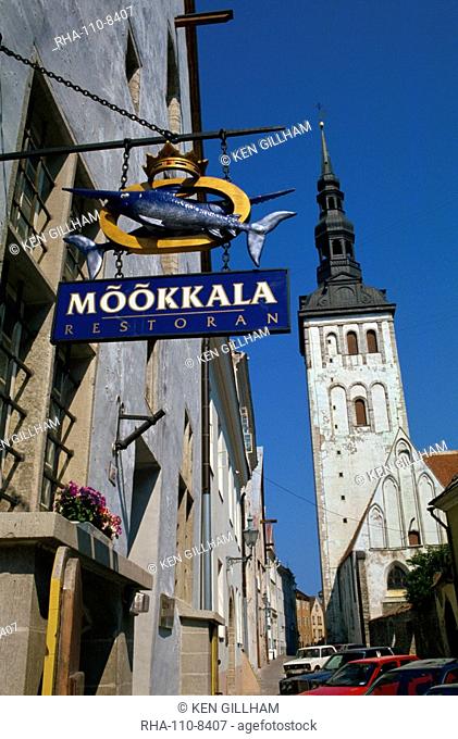 Sign for the Mookkala Restaurant with the Niguliste Church behind, Old Town, Tallinn, Estonia, Baltic States, Europe