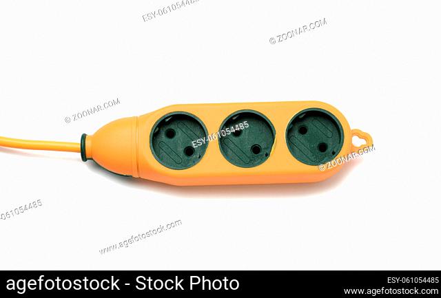 rubber orange power strip with three sockets isolated on white background, top view