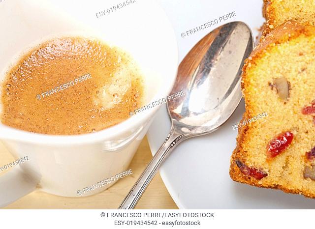 plum cake and espresso coffee over a white rustic table