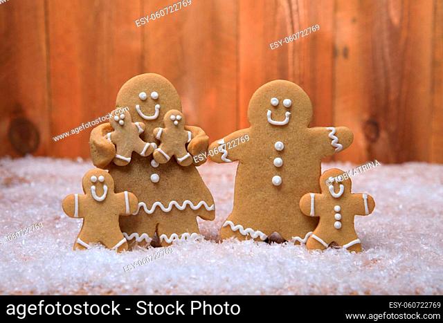 Gingerbread Family of 4 kids on Holiday Christmas Background