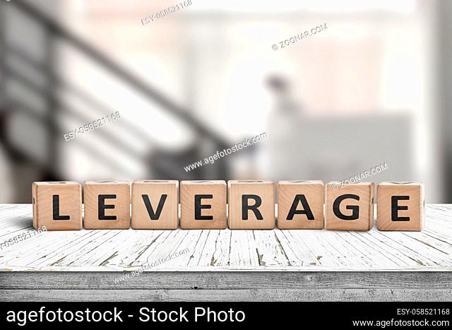 Leverage sign in a office environment on a wooden desk