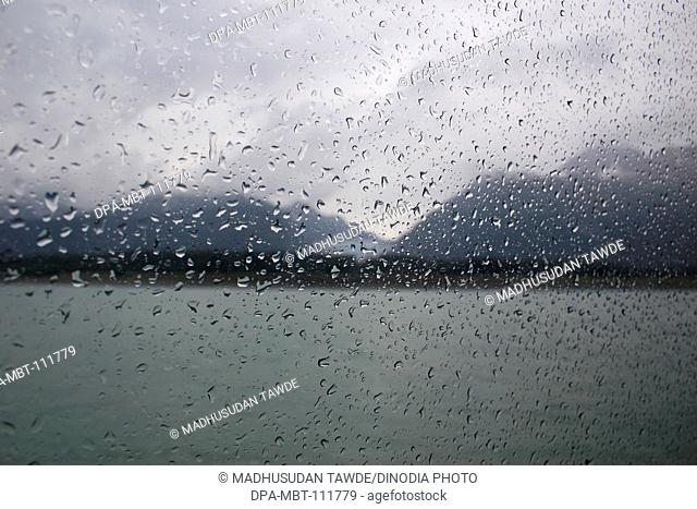 Raindrops on window glass of ship ; Skagway ; Alaska ; U.S.A. United States of America