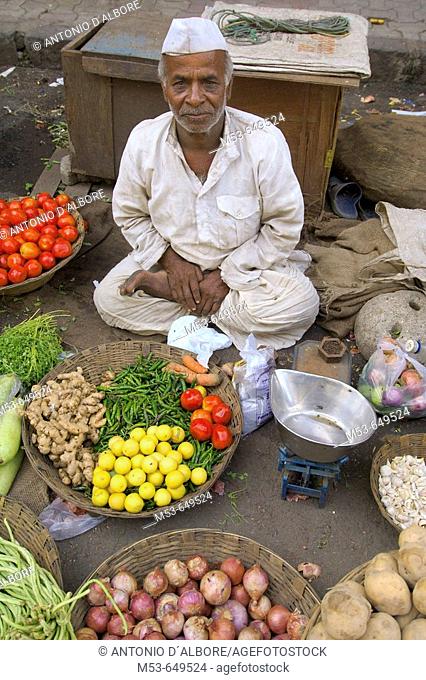 street seller of vegetables in south mumbai. mumbay city. maharashtra. india. asia
