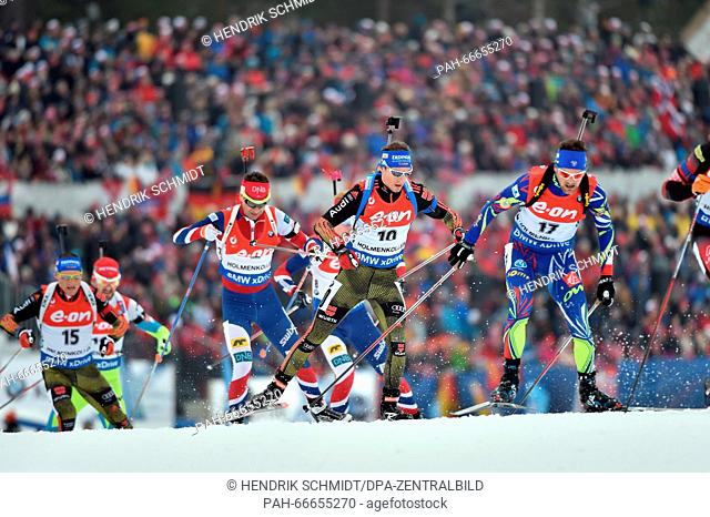 Simon Schempp (C) of Germany in action during the Men 15km Mass Start competition at the Biathlon World Championships, in the Holmenkollen Ski Arena, Oslo