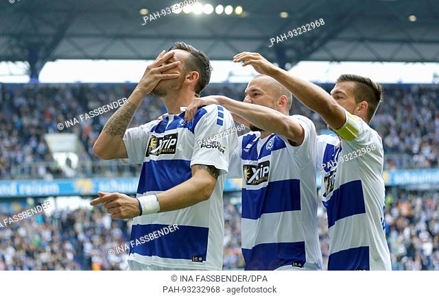 dpatop - Duisburg's Borys Taschtschi (left to right), Simon Brandstetter and Kevin Wolze celebrating the 1:0 during the 2nd Bundesliga match pitting MSV...