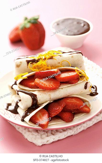 Pancakes with strawberries and chocolate & orange sauce