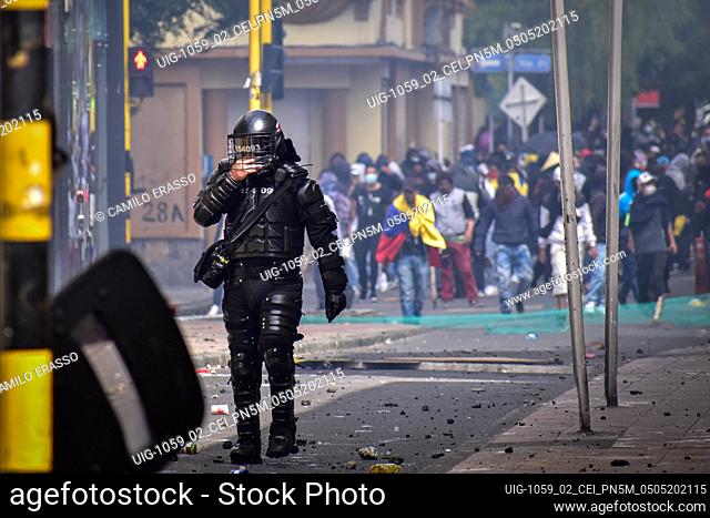 Riot police member are affected by tear gas in Pasto Narino on May 5, 2021 after killings perpetrated by police rise up to at least 19 since the strike started