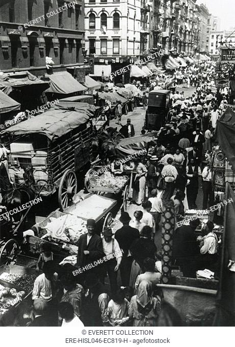 NYCs Lower East Sides Hester Street, crowded with people, pushcart peddlers, horses, and wagons, c. 1900-1910. Many Jewish immigrants from Eastern Europe...