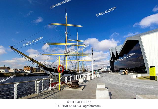 Scotland, Lowlands, Glasgow. Rear of Glasgow Riverside Museum and the tall ship Glenlee moored in the Clyde