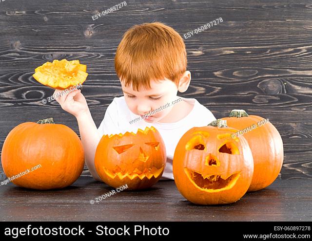 scary pumpkins of which are preparing lamps to celebrate Halloween in the autumn season, homemade products made roughly and not neatly