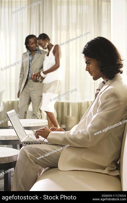 Middle Eastern businessman typing on laptop