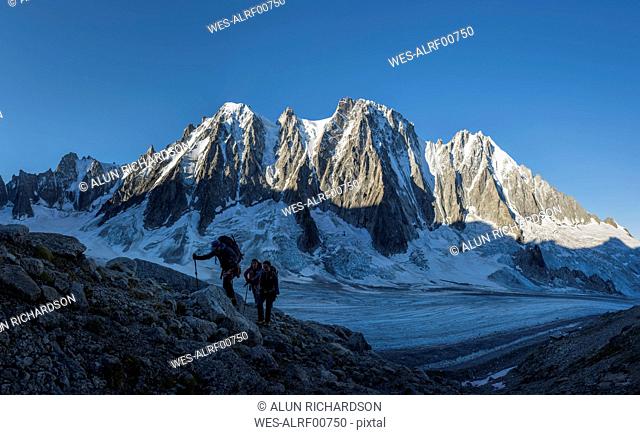 France, Chamonix, Argentiere Glacier, Les Droites, Les Courtes, Aiguille Verte, group of mountaineers