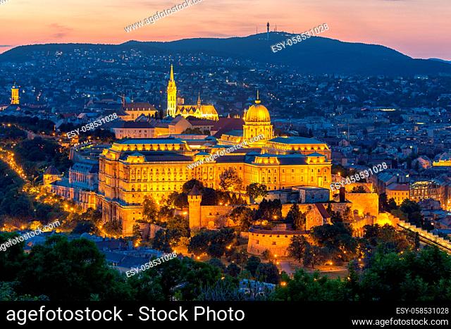 Aerial view illuminated Budapest Castle at sunset, Hungary