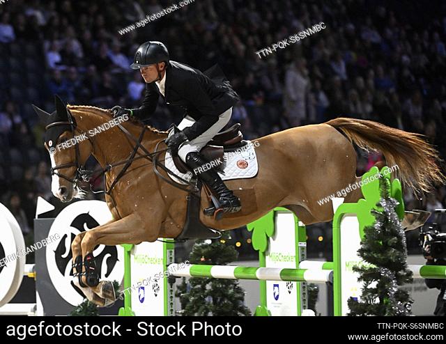 Jerome Guery of Belgium rides the horse Careca Ls Elite during the international jumping competition at the Sweden International Horse Show at Friends Arena in...