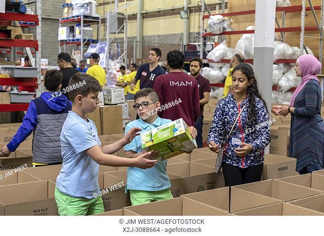 Novi, Michigan USA - Muslim volunteers package food boxes for the less fortunate in the Detroit area during the month of Ramadan