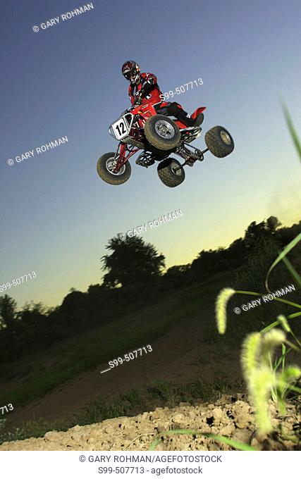 action, motocross, solo caucasian male jumping All-Terrain-Vehicle. Kansas City, Missouri, USA