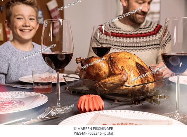 Turkey on table during family's Christmas dinner