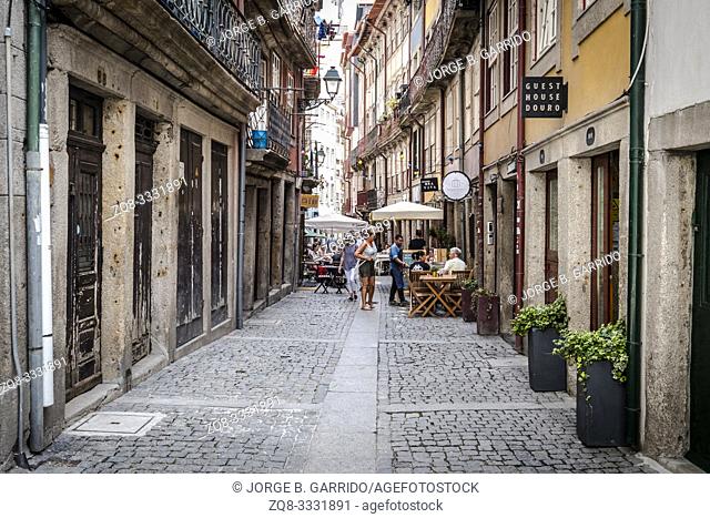 Tourists and locals walking the streets of Porto, Portugal. Porto is the 2nd largest city in Portugal. Its old town is a UNESCO World Heritage Site