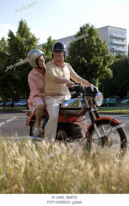 Senior couple happy on motorbike