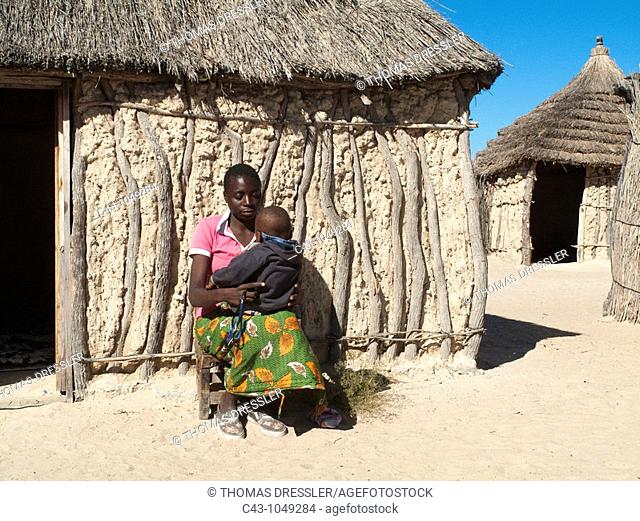 Namibia - Kavango woman with child in her village near the town of Rundu  Kavango region, Namibia
